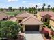 Stunning aerial view of the house showing the tile roof and lush backyard at 22504 N San Ramon Dr, Sun City West, AZ 85375