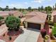An elevated view of the home featuring a tile roof and desert landscaping at 22504 N San Ramon Dr, Sun City West, AZ 85375