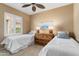Charming bedroom with neutral colors, two twin beds, and a window with shutters at 22504 N San Ramon Dr, Sun City West, AZ 85375