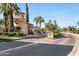 Visitor and Resident Entrance at Guard House with Lush Greenery and Palm Trees at 22504 N San Ramon Dr, Sun City West, AZ 85375