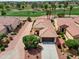 Charming single-Gathering home with a tile roof, desert landscaping, and views of a golf course at 22504 N San Ramon Dr, Sun City West, AZ 85375