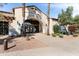 Corte Bella Golf Club entrance featuring an archway, manicured landscaping, and clear signage at 22504 N San Ramon Dr, Sun City West, AZ 85375