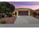 Charming home featuring a tile roof, desert landscaping, and a spacious two-car garage at 22504 N San Ramon Dr, Sun City West, AZ 85375