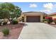 Inviting home featuring a tile roof, desert landscaping, and a spacious two-car garage at 22504 N San Ramon Dr, Sun City West, AZ 85375