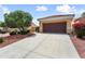 Front view of home featuring a tile roof, desert landscaping, and a two-car garage at 22504 N San Ramon Dr, Sun City West, AZ 85375