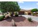 Home featuring a tile roof, desert landscaping, and a spacious two-car garage at 22504 N San Ramon Dr, Sun City West, AZ 85375