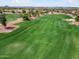 Expansive view of a verdant golf course with well-manicured greens and rolling hills at 22504 N San Ramon Dr, Sun City West, AZ 85375