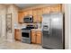 Modern kitchen boasts stainless steel appliances, a gas range, and ample cabinet space at 22504 N San Ramon Dr, Sun City West, AZ 85375