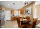 Bright kitchen with tan color scheme, tile floors, breakfast nook, and stainless steel appliances at 22504 N San Ramon Dr, Sun City West, AZ 85375