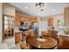 Eat-in kitchen features stainless steel appliances, wood cabinetry and a cozy breakfast nook at 22504 N San Ramon Dr, Sun City West, AZ 85375