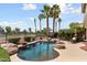 Relax in your private backyard oasis with lush landscaping and lagoon style pool at 22504 N San Ramon Dr, Sun City West, AZ 85375