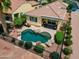 Aerial view of backyard oasis featuring a kidney-shaped pool, patio, and desert landscaping at 22504 N San Ramon Dr, Sun City West, AZ 85375