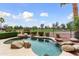 Enjoy a beautiful custom pool with boulder accents overlooking the golf course at 22504 N San Ramon Dr, Sun City West, AZ 85375