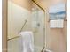 This bathroom features a shower with glass doors and gold trim and towel racks at 22504 N San Ramon Dr, Sun City West, AZ 85375