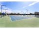 Well-maintained tennis courts featuring blue and green surfaces and overhead lighting at 22504 N San Ramon Dr, Sun City West, AZ 85375