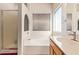 Clean bathroom showcasing a large tub, separate shower, and plenty of natural light at 2327 E Edna Ave, Phoenix, AZ 85022