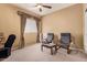 Cozy bedroom featuring two relaxing chairs and large window with elegant valance at 2327 E Edna Ave, Phoenix, AZ 85022