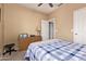 Comfortable bedroom featuring a ceiling fan and traditional wooden dresser at 2327 E Edna Ave, Phoenix, AZ 85022