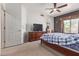 Spacious bedroom featuring dark walls and a ceiling fan, offering a serene retreat at 2327 E Edna Ave, Phoenix, AZ 85022