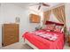 Cozy bedroom features a ceiling fan and spacious dresser for ample storage at 2327 E Edna Ave, Phoenix, AZ 85022