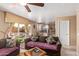 Bright living room with cozy seating, sliding glass door to a charming outdoor area, and an open floorplan at 2327 E Edna Ave, Phoenix, AZ 85022