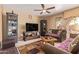 Inviting living room featuring comfortable seating, modern entertainment center, and soft natural light at 2327 E Edna Ave, Phoenix, AZ 85022