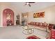 Cozy living room with a plush couch, unique hanging chair, and vibrant decor at 2327 E Edna Ave, Phoenix, AZ 85022