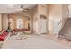 Bright, open living room with high ceilings, staircase, large windows and plush, unique seating at 2327 E Edna Ave, Phoenix, AZ 85022