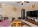 Inviting living room featuring cozy furniture, a modern entertainment center, and ambient lighting at 2327 E Edna Ave, Phoenix, AZ 85022