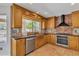 Well-lit kitchen featuring custom cabinets, granite countertops, stainless steel appliances at 2340 W Myrtle Dr, Chandler, AZ 85248