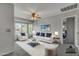 Bright, staged living room featuring modern furniture, ceiling fan and lots of natural light at 2340 W Myrtle Dr, Chandler, AZ 85248