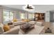 Inviting living room with access to the dining area, kitchen, and sliding door to the backyard at 2340 W Myrtle Dr, Chandler, AZ 85248
