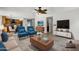 Cozy living room featuring an open floor plan with views of the kitchen and dining area at 2340 W Myrtle Dr, Chandler, AZ 85248