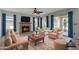Stylish living room with a fireplace, comfortable seating, and sliding glass doors to backyard at 2340 W Myrtle Dr, Chandler, AZ 85248