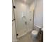 Contemporary bathroom with a glass-enclosed shower, modern fixtures, and a tiled backsplash at 24088 S 218Th Pl, Queen Creek, AZ 85142