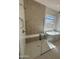 Modern bathroom features a glass-enclosed shower, built-in bench, and a freestanding soaking tub at 24088 S 218Th Pl, Queen Creek, AZ 85142