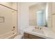 Bright bathroom featuring subway tile shower and modern vanity with gold fixtures at 24088 S 218Th Pl, Queen Creek, AZ 85142