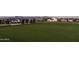 Manicured community green, perfect for relaxing, playing games, and enjoying the outdoors with neighbors and friends at 24088 S 218Th Pl, Queen Creek, AZ 85142