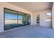 Inviting covered patio featuring sliding glass doors, offering seamless indoor-outdoor living and backyard access at 24088 S 218Th Pl, Queen Creek, AZ 85142