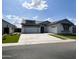 Charming single-story home with a two-car garage and manicured landscaping at 24088 S 218Th Pl, Queen Creek, AZ 85142