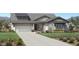 Beautiful home exterior with a manicured lawn, driveway, and a two-car garage for added convenience at 24088 S 218Th Pl, Queen Creek, AZ 85142