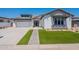 Beautiful single-Gathering home with a well-manicured lawn and a neutral color scheme at 24088 S 218Th Pl, Queen Creek, AZ 85142