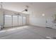 Spacious and bright two-car garage with ample lighting, a sealed concrete floor, and an automatic door opener at 24088 S 218Th Pl, Queen Creek, AZ 85142