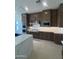 A gourmet kitchen featuring stainless steel appliances, marble countertops, and ample cabinet space at 24088 S 218Th Pl, Queen Creek, AZ 85142