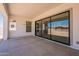 Covered patio with large sliding glass doors, perfect for outdoor living and entertaining at 24088 S 218Th Pl, Queen Creek, AZ 85142