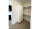 Well-organized walk-in closet with shelving, drawers, and ample storage space for clothing and accessories at 24088 S 218Th Pl, Queen Creek, AZ 85142