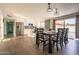 Open dining and kitchen area with modern white cabinets, stainless appliances, and sliding glass doors at 2430 E Hermosa Dr, Tempe, AZ 85282