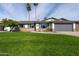 Charming single-story home with a well-manicured lawn, desert landscaping, and attached two-car garage at 2430 E Hermosa Dr, Tempe, AZ 85282