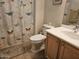 Bathroom with decorative butterfly curtain, tile floor, wooden vanity at 27158 W Potter Dr, Buckeye, AZ 85396