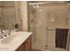 Bathroom with a glass-enclosed shower and a vanity with a white countertop at 27158 W Potter Dr, Buckeye, AZ 85396